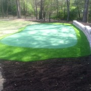 turf innovations synthetic putting green surrounded by mulch